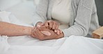 Senior couple, support and holding hands in hospital with love and care at clinic. Elderly patient, kindness and marriage with trust and healthcare with medical help and homecare with empathy