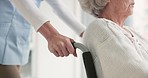 Nurse, senior woman and push wheelchair with helping hand, care and support for rehabilitation in clinic. Medic, elderly person with disability and mobility with empathy, kindness and retirement