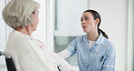 Healthcare, wheelchair and a woman nurse talking to a senior patient with a disability in a clinic. Medical, retirement and support with a female medicine professional talking to a resident at home