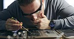 Electric maintenance, board and a man with tools for a computer service and focus on circuit. Technology, programming and a pc technician working on hardware of electronics or building a motherboard