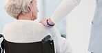 Hand, shoulder and wheelchair with an elderly woman in a nursing home for trust, wellness or empathy. Back, comfort or care with a senior female patient with a disability feeling support from a nurse