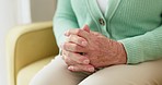 Hands, anxiety and senior woman on a sofa with stress, fear or grief, dementia or scared in her home. Stress, worry and nervous elderly female in a living room with Alzheimer, arthritis or depression