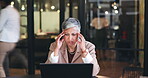 Thinking, headache and laptop with business woman in office for fatigue, anxiety or stress. Mental health, burnout and frustrated with senior employee and blur for glitch, confused or project problem