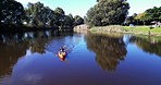 Kayak, people in boat and lake, camp and sports in nature, paddle and exercise with camper activity outdoor. Woods, river and adventure, fitness and active in summer, freedom and rowing with top view