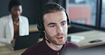 Call center, headset and a man talking at his desk in a coworking office for crm and support. Male consultant or agent at computer for customer service, account information and help desk advice