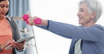 Tablet, dumbbells and an elderly woman in a physiotherapy clinic for rehabilitation, recovery or mobility. Healthcare, medical or research and a senior person training with her physiotherapist