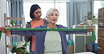 Physiotherapy, stretching band and a senior patient with a woman for physical therapy. Elderly person with a physiotherapist for muscle exercise, workout or rehabilitation with support in retirement