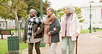 Senior, conversation and relax with friends in park for retirement, happy and health. Elderly, happiness and social with group of old women walking in nature for wellness, support and peace together