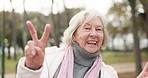 Peace, hand and senior woman face in park happy, good mood and positive vibes outdoors. V, sign and elderly lady portrait with emoji for freedom, fun and celebration while enjoy retirement in nature