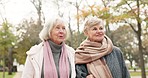 Senior, women and friends in a park bond, walking and enjoying conversation outdoor together. Elderly, ladies and happy, walk and talking in in a forest on weekend, relax and having fun in nature