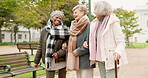 Senior, conversation and retirement with friends in park for relax, happy and health. Elderly, happiness and social with group of old women walking in nature for wellness, support and peace together