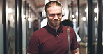 Professional, man, dancing and with headphones at office in hallway with greeting to employee in hallway. Freedom, success and male worker is listening to music and walking with feeling positive.