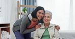 Happy woman, patient and volunteer in elderly care for support, trust or physiotherapy at old age home. Portrait of female nurse, physio or caregiver hug senior person with a disability in retirement