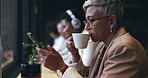 Business woman, phone and coffee shop for social media ideas, networking inspiration or communication. Business person or senior entrepreneurship drinking tea at restaurant or cafe for remote work
