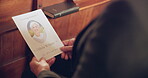 Love, memory and person in church for a funeral, service program or paper programme with face of senior woman on a pamphlet. Mourning, death from cancer and grief of person or family in chapel