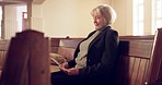 Christian, waiting and senior woman in a church for service for spiritual wellness and prayer. Holy, peace and elderly female person sitting on wood bench for Sunday worship sermon in religion chapel