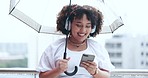 Rain, happy and business woman in city with phone for streaming song, audio and radio in urban town. Umbrella, corporate and female person in winter with headphones on travel, commute and journey