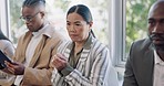 Anxiety, interview and woman in waiting room with candidates at recruitment agency. Human resources, hiring and fear, men and women in lobby with hope, motivation and stress for new job opportunity.