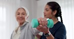 Woman, nurse and dumbbell in elderly care for physiotherapy, exercise or workout at old age home. Female doctor, caregiver or personal trainer helping senior patient in weightlifting for healthy body