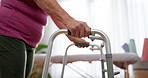 Walker, closeup and hands of senior woman in physiotherapy to recover mobility and stability in rehabilitation. Healthcare, training and elderly person in a retirement medical clinic or nursing home