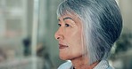 Thinking, sad and a senior woman with a memory, depression or Alzheimer during retirement. Closeup, face and an elderly person in the living room of a home with anxiety, depressed and mistake