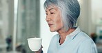 Home, peace and elderly woman with coffee, retirement and relax with wellness, lounge and memory. Old lady, senior female person and blowing morning tea with health, remember and calm with nostalgia