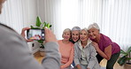 Senior fitness, women and person with a photo for a yoga, exercise or workout memory together. Smile, group and coach taking picture of elderly friends at a training studio for a class in retirement