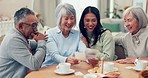 Family pictures, bonding and home with grandparents looking at memory at afternoon tea. House, photo and happy people together with smile and communication from nostalgia with conversation at table