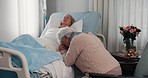 Bible, holding hands and senior women in hospital for prayer, hope or support, empathy and comfort. Elderly friends, book of religion and patient with cancer, sick or medical disease on bed in clinic