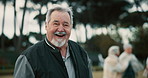 Happy, face and a senior man in nature for retirement games, fun and relax with friends. Laughing, summer and portrait of an elderly person with a smile in a garden or field for outdoor energy