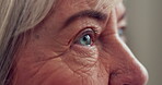 Eyes, senior woman and focus for eye exam, test or assessment of vision, eyesight and optometry for elderly patient. Eye, problem and closeup on old lady with wrinkles, natural skin and wellness