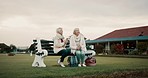 Talking, senior friends and at a club for sports, fitness break and sitting together after exercise. Happy, relax and elderly women on a field bench for conversation, retirement hobby or activity