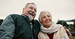 Senior, couple and hug on bench at park with happiness for quality time or to relax. Happy face, retirement and elderly man or woman in nature with embrace for love or laugh and support with bonding.