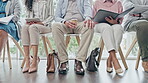 Legs, workers and waiting room for hiring, recruitment or job opportunity. Group, human resources and business people in line for onboarding, hr or career interview for employment in corporate office