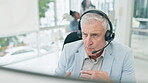 Talking, headset and a man in a call center for customer service, telemarketing and crm. Serious male consultant at a computer for technical support, sales or help desk with account information