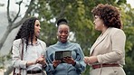Tablet, planning and business women in park for discussion, meeting and networking. Corporate, teamwork and female workers outdoors talking for review, project and online proposal on digital tech