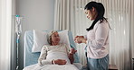 Woman, nurse and patient with medication in elderly care on bed for healthcare support at the hospital. Female volunteer, caregiver or physiotherapist giving senior person pills or drugs at clinic