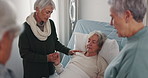 Cancer, support and a senior woman in the hospital with her friends during a visit to comfort or console. Healthcare, medical and love with a female patient lying in a bed at the clinic for recovery