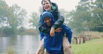 Piggy back, friends and outdoor together for a happy date, adventure or walking in the park, woods or camping in nature. Couple, smile and man with support on vacation, trip or hiking in the forest