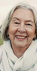 Happy, smile and face of senior woman laughing at a comic, funny or comedy joke while standing in a park. Nature, happiness and portrait of calm elderly female person with positive mindset in garden.