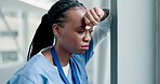 Sad, doctor and woman by window with headache, stress and anxiety from bad news. Hospital, African female professional and burnout from work of clinic employee with mental health problem and grief
