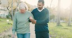 Walk, crutch and man with his senior mother in a park for support, help or balance in nature. Medical, wellness and young male person doing a cardio exercise with his elderly mom in an outdoor garden