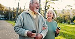 Retirement, coffee and an elderly couple walking in the park together for romance during summer. Love, relax or peace with a senior man and woman in a nature garden, talking while bonding on a date