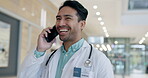 Phone call, funny and doctor walking in a hospital corridor talking on a mobile conversation for communication planning. Laughing, medical and professional in healthcare clinic speaking about advice