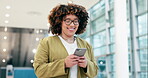 Smile, phone and a woman with a chat at work for social media notification, email or an app. Happy, reading and a young female employee with a mobile for internet and communication while walking