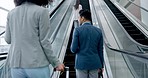 Airport, back and business colleagues on an escalator with luggage for global travel or transport. Corporate, international and professional people in a terminal, leaving for a trip or journey