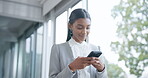 Business woman, walking and typing on smartphone for social network, mobile website and digital contact. Happy indian female worker reading online news, notification and app on cellphone in office 