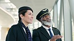 Travel, pilot and stewardess in conversation at the airport before boarding a flight in the city. Discussion, communication and hospitality air crew team talking about a strategy in urban town hotel.