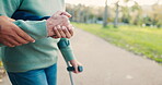 Hands, caregiver and helping a patient in outdoor for retirement, exercise or healthcare. Nurse, closeup and senior person for wellness in nature with care or workout with physio therapy at park.