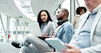 Business people, talking and working in airport for travel, trip or flight departure from international terminal lounge or lobby. African, businessman on computer and woman in work conversation